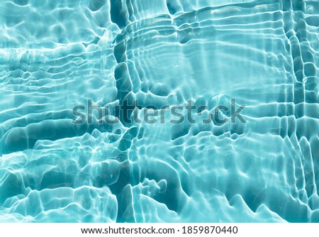 Cosmetic moisturizer water toner Blue. Surface texture with splashes and bubbles. Abstract trendy nature background.