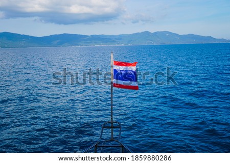 flag of thailand in blue sea