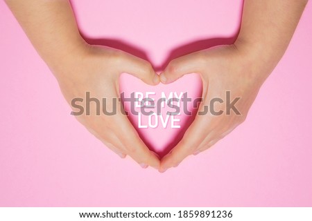 Be my love. Heart made with woman's hands. Concept of love and saint vanlentine