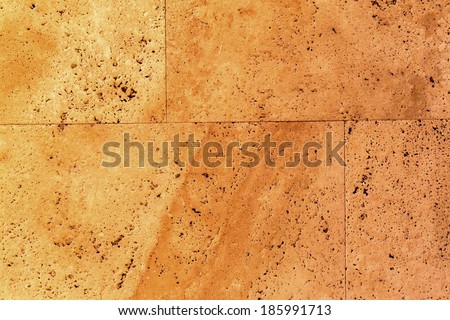 beautiful old yellow-brown decorative stone marble abstract cracks and stains on the surface as natural background