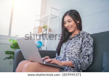 Beautiful businesswoman using computer laptop smart technology contact email networking browsing internet happy smiling joyful cheerful researching business strategy planning new innovative ideas