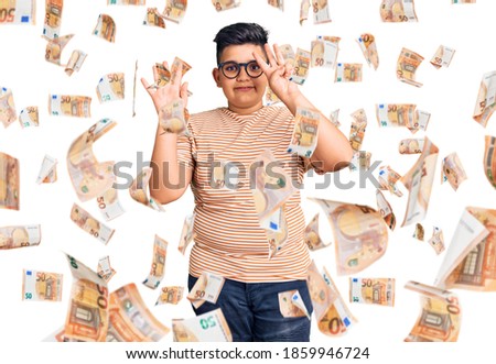 Little boy kid wearing casual clothes and glasses showing and pointing up with fingers number eight while smiling confident and happy.