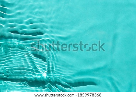 Abstract trendy nature background. Cosmetic moisturizer water toner blue. Surface texture with splashes and bubbles. 