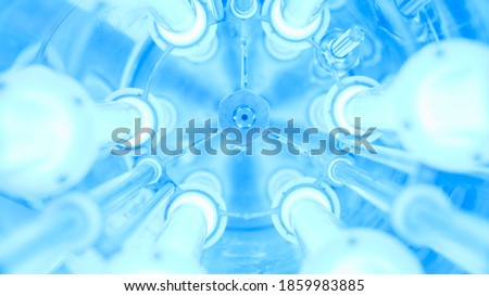 UV water purifier. Media. Close-up of bright ultraviolet flasks in device. UV device with blue light for cleaning water from chlorine. Futuristic UV flasks Royalty-Free Stock Photo #1859983885