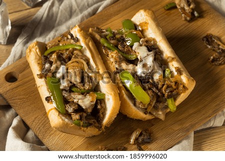 Homemade Philly Cheesesteak Sandwich with Peppers and Beef Royalty-Free Stock Photo #1859996020