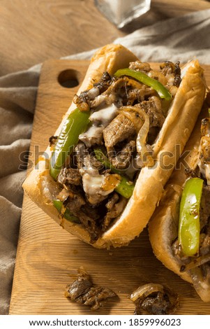 Homemade Philly Cheesesteak Sandwich with Peppers and Beef Royalty-Free Stock Photo #1859996023