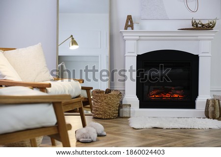 Beautiful living room interior with fireplace and armchairs