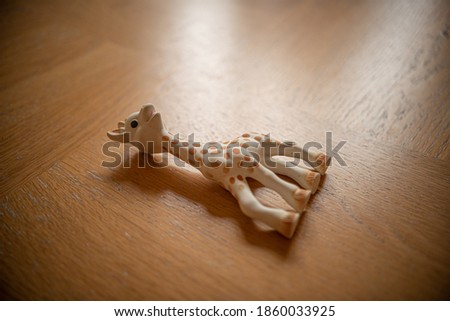 Toy giraffe on a wooden table