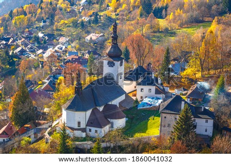 The Spania Dolina village with church and historic buildings in valley of autumn  landscape, Slovakia, Europe. Royalty-Free Stock Photo #1860041032