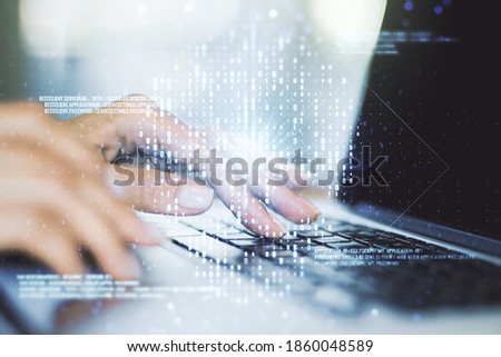 Creative code skull hologram and hands typing on computer keyboard on background, cybercrime and hacking concept. Multiexposure