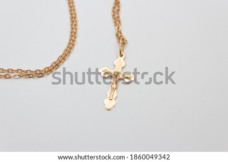 Cross gold, a symbol of the Christian faith Royalty-Free Stock Photo #1860049342