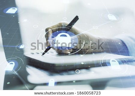Creative lock sketch with chip hologram and hand writing in notepad on background with laptop, protection of personal data concept. Multiexposure