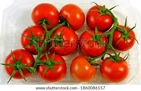 Vine ripe tomatoes in a plastic tray