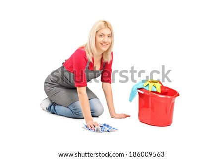 Woman cleaning the floor isolated on white background
