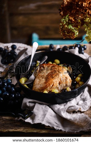 Baked turkey breast with grapes..style rustic.selective focus