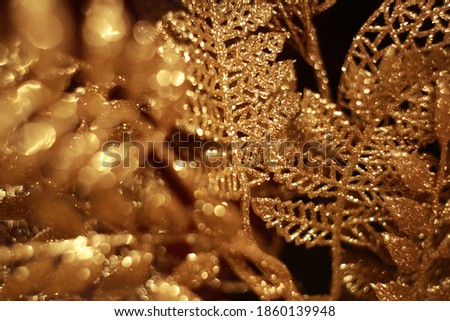 Shiny golden leaves with glitter. Christmas decoraitons.
