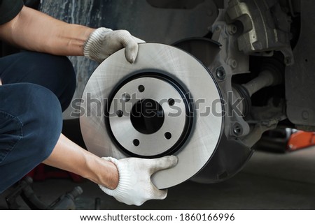Brand new brake discs for garage cars. Auto mechanic
