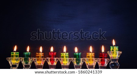Religion image of jewish holiday Hanukkah background with menorah (traditional candelabra) and candles
