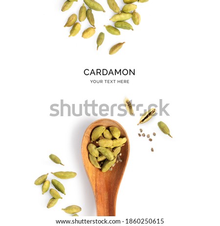 Creative layout made of cardamom and wood spoon on a white background. Top view.   Royalty-Free Stock Photo #1860250615
