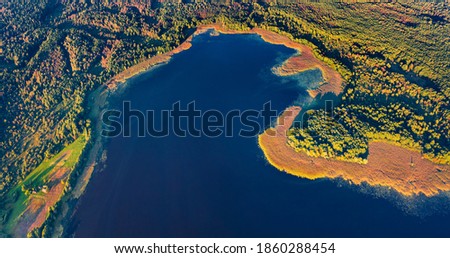 Straight down view of Krymne Lake. First sunlight glooving the shoure of fishing lake. Bright morning scene of Shatsky National Park, Volyn region, Ukraine, Europe. Aerial landscape photography.
 Royalty-Free Stock Photo #1860288454