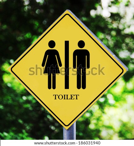 Yellow road sign outdoor with toilet pictogram