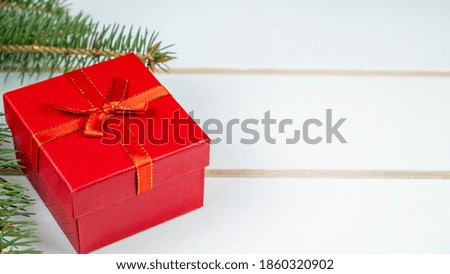 Christmas gift box on wooden background. Copy space