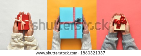 Colorful gift boxes for the holiday in the hands of people. Surprises for new year, Christmas or birthday