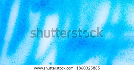 Blue paint on the snow in winter. Abstract background .