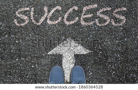 two foot on asphalt road with arrow pointing to success. Illustration of the improvement, new normal, team building.