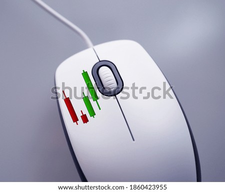 Stock price candle stick pattern on computer mouse concept stock trading online 