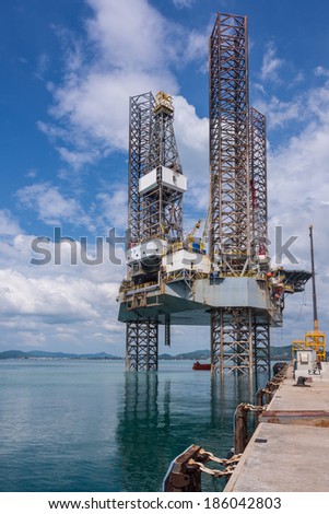 Jack up oil rig with almost fully leg up at shipyard