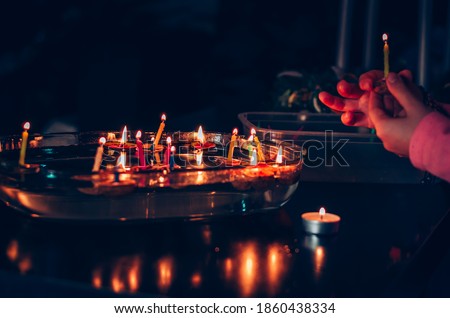 christmas tradition of nut shells floating on water surface, eastern Europe tradition with bokeh background