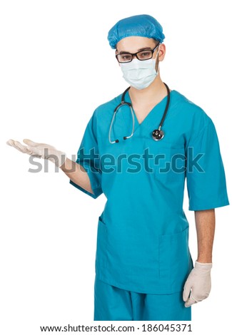  Portrait of a  young doctor (nurse), holding out her hand as displaying something isolated