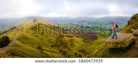 A photographer shooting in Peak District, an upland area in England at the southern end of the Pennines, UK