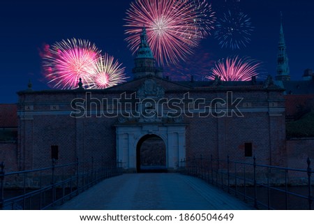Celebratory fireworks for new year over Kronborg Castle in Copenhagen, Denmark during last night of year. Christmas atmosphere. 