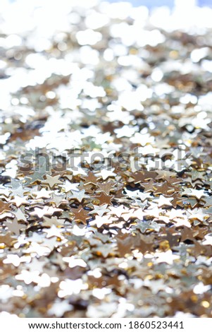 macro confetti golden stars, background