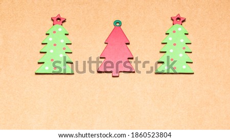 Christmas greetings card made of colored cardboard trees. Space for copying. Advertising banner