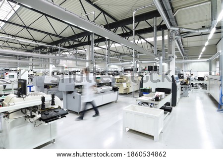modern industrial factory for the production of electronic components - machinery, interior and equipment of the production hall  Royalty-Free Stock Photo #1860534862