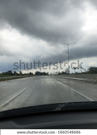 Driving car in cloudy afternoon 