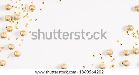 Christmas holiday composition. Xmas golden decorations on white background. Christmas, New Year, winter concept. Flat lay, top view, copy space