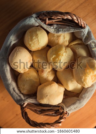 Close up of Traditional Brazilian snack called Cheese Bread "Pao de queijo" in basket.