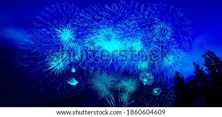New Year celebration fireworks with blue color for text.Banner background.Festive, Festival, Celebrate in counting down Happy New year.Abstract colored firework background with free space for text