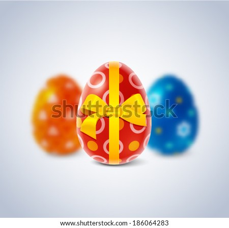 Easter eggs with ribbon and bow and blurred background 