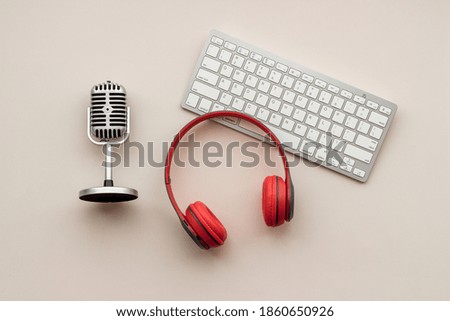 Microphone and headphones on studio table, top view. Audio equipment and recording