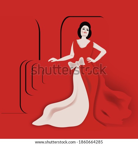 A woman poses in a red gown.