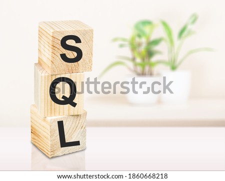 SQL - Structured Query Language - concept, cube wooden block with alphabet