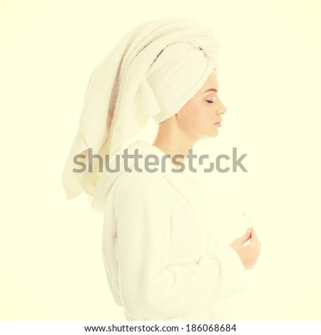 Portrait of young beautiful woman wearing bathrobe 