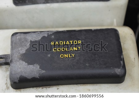 Radiator coolant only sign on a car
