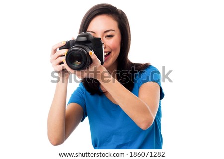 Beautiful female photographer taking a snap