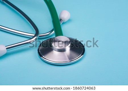 Stethoscope for doctor diagnostic coronavirus disease, medical tool for health on blue background with copy space